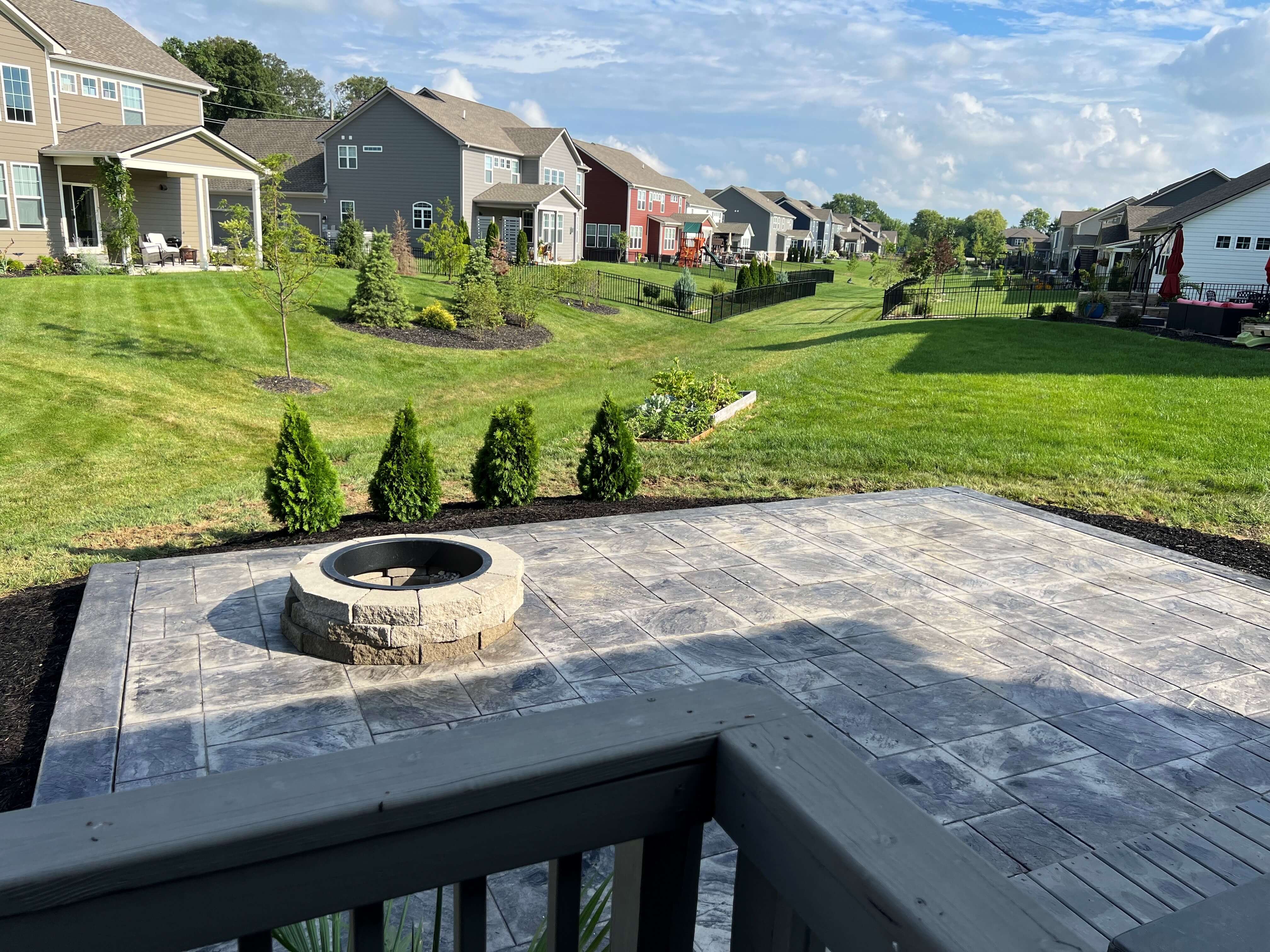 Luxury stamped concrete pour with fire pit fishers Indiana
